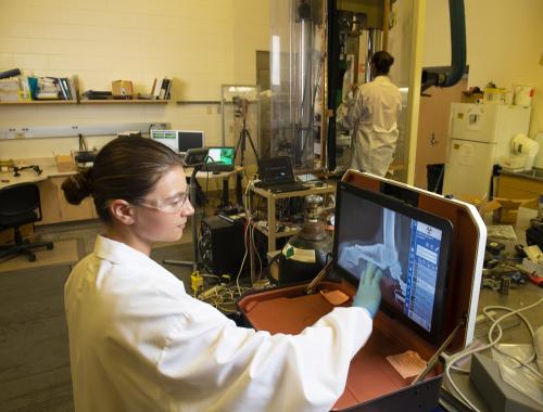 researchers looking at an X-ray in the laboratory