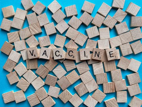 Scrabble tiles spelling out "vaccine"